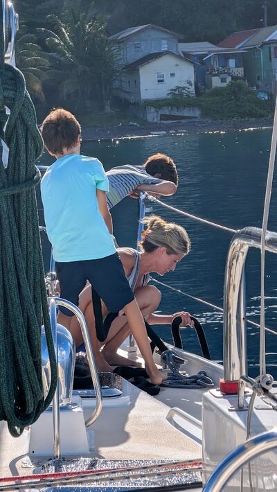 Julie and the kids working together aboard